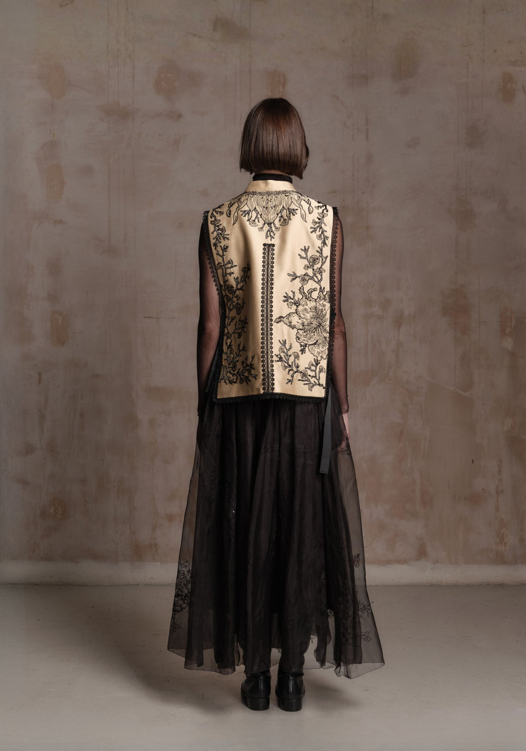 Beige Vest with Black Beadings and Ribbon on the Side